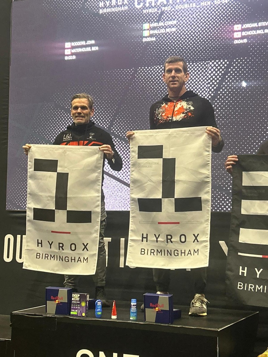 Conor and his doubles partner on the top step of the Hyrox Birmingham podium